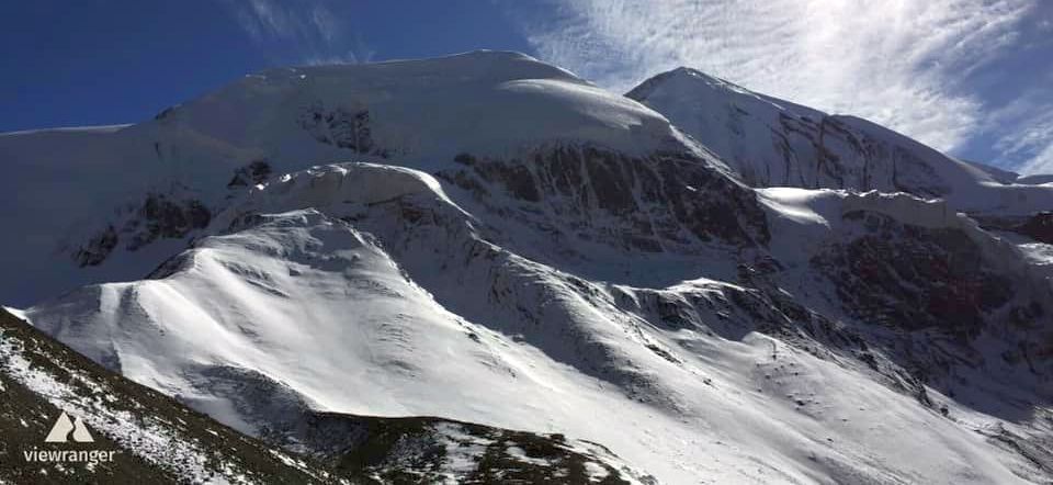 Tharong Peak ( Thorong Ri ) above Tharong La on crossing Tharong La high pass on Annapurna circuit trek in the Nepal Himalaya