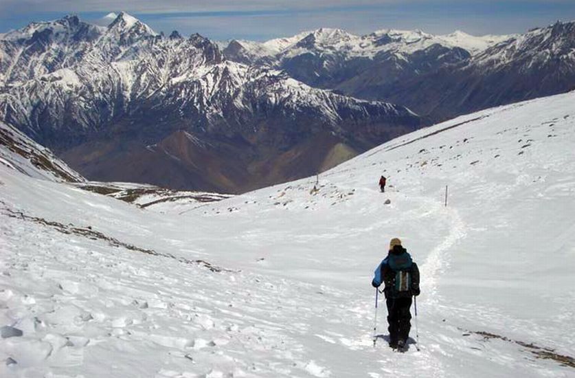 View of Himalayan Peaks on descent from Tharong La high pass on Annapurna circuit trek in the Nepal Himalaya