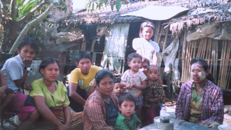 Chicha ( private tourist guide ) and family in home town of Dalah across the Yangon River from Yangon ( Rangoon ) in Myanmar ( Burma )