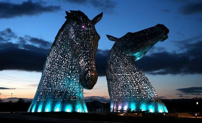 The Kelpies illuminated at night